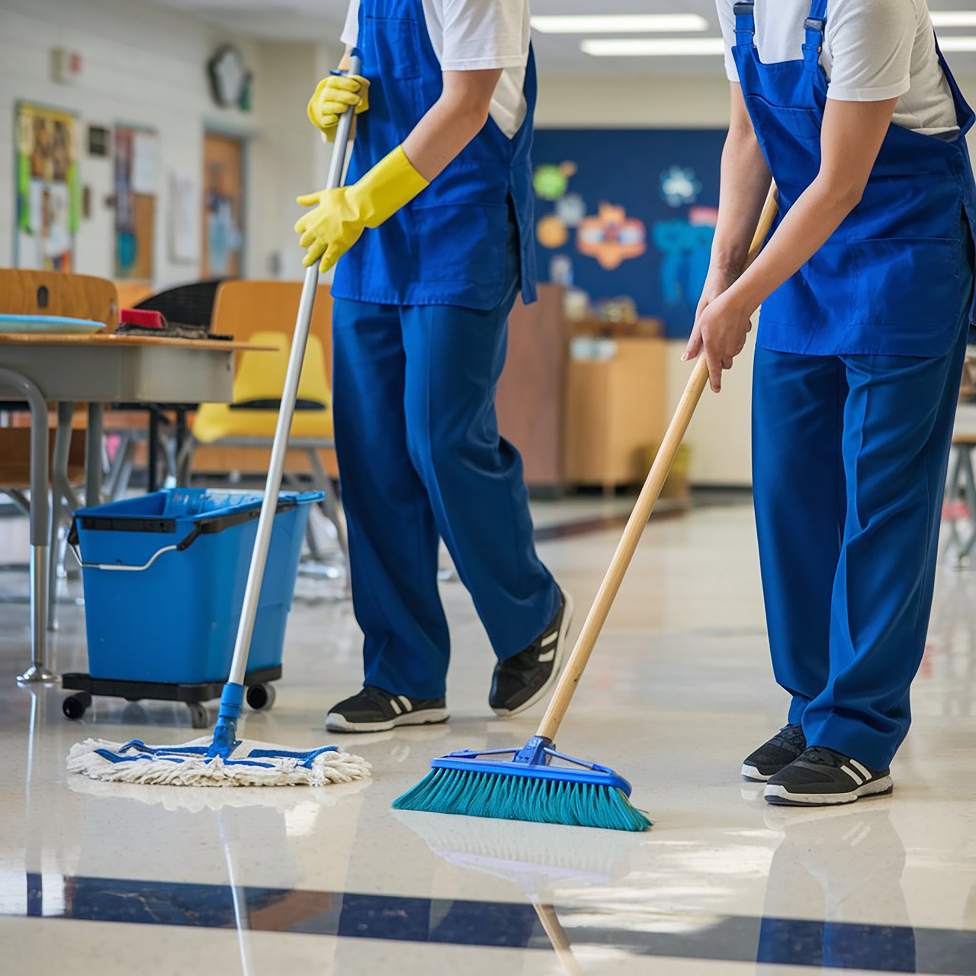photo two janitors working together clean