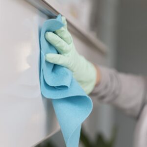 side view hand with glove cleaning surface with cloth (1) side view hand with glove cleaning surface with cloth (1)